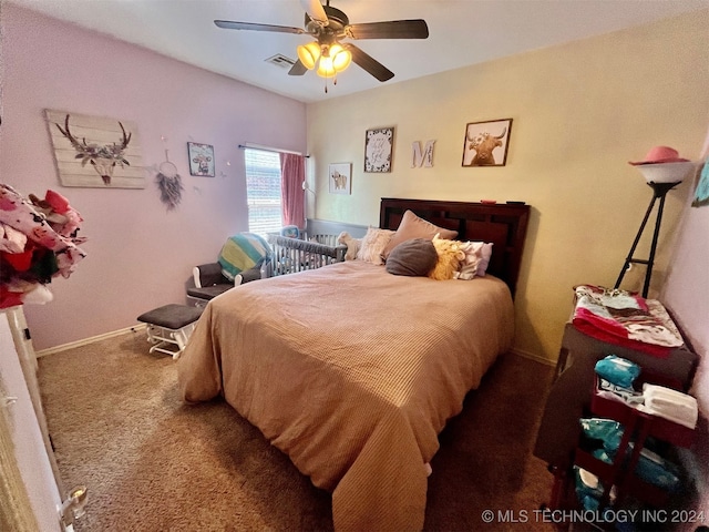 bedroom featuring ceiling fan and carpet