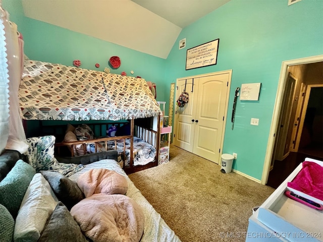 living room featuring carpet and vaulted ceiling