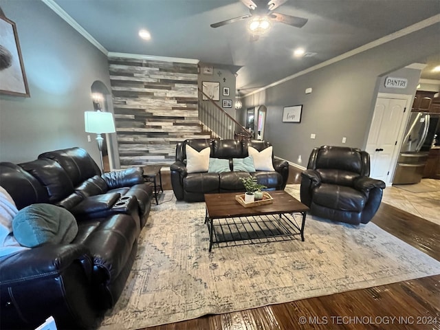 living room with ceiling fan, hardwood / wood-style flooring, and ornamental molding