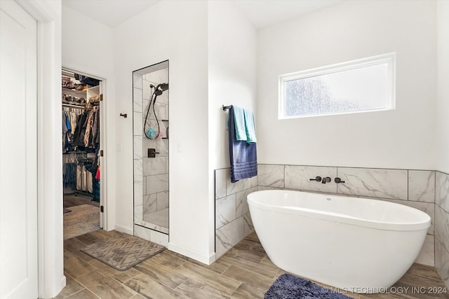 bathroom featuring plus walk in shower