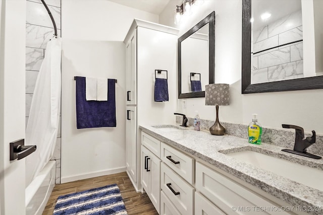 bathroom with vanity and shower / tub combo with curtain