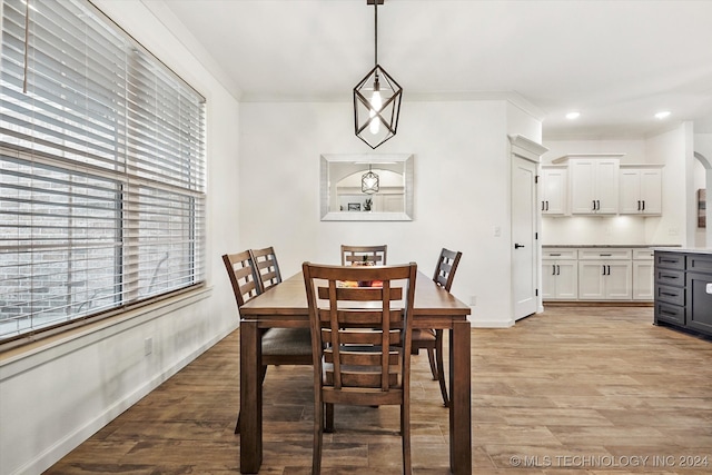 dining space featuring a wealth of natural light and light hardwood / wood-style floors