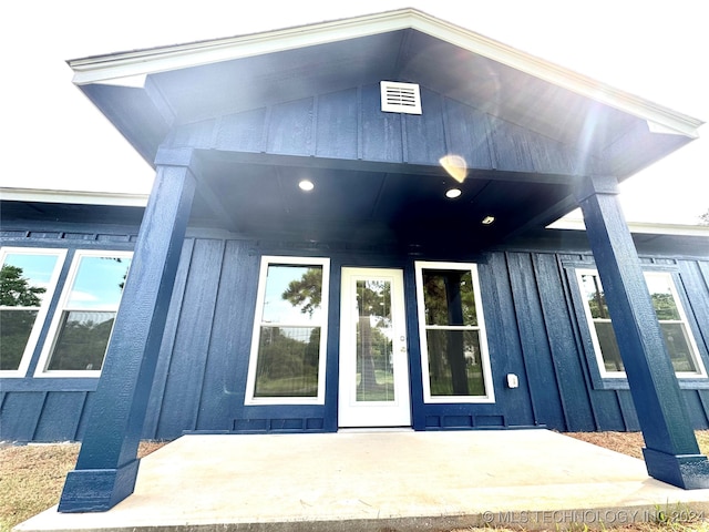 doorway to property featuring a patio area