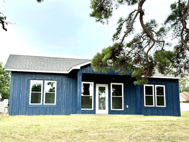 view of outbuilding with a lawn