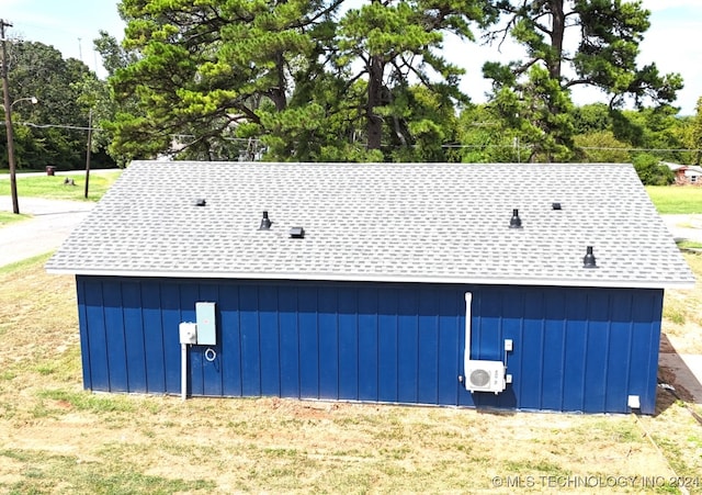 view of side of property with a yard