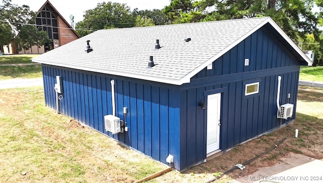 view of side of home with a lawn