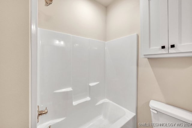 bathroom with toilet and shower / bathtub combination