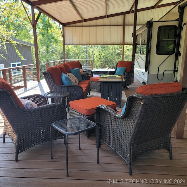 wooden deck featuring an outdoor living space