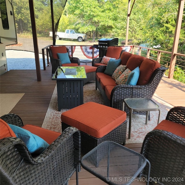 wooden terrace with outdoor lounge area