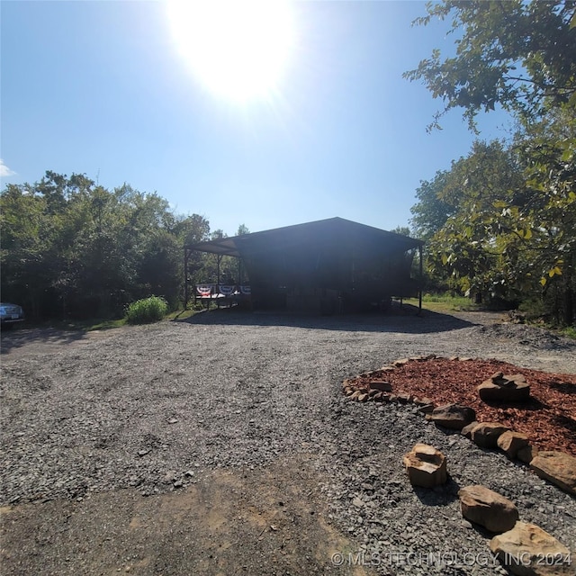 view of property exterior featuring a carport