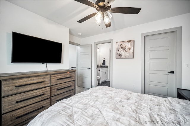 bedroom featuring ceiling fan and ensuite bathroom