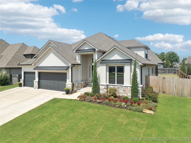 view of front facade featuring a garage and a front lawn