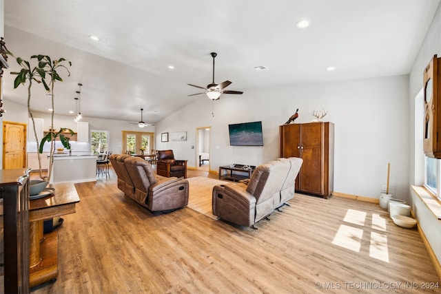 living room with vaulted ceiling, light wood-type flooring, and ceiling fan