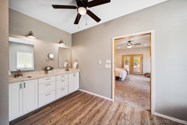 bathroom featuring vanity, hardwood / wood-style flooring, french doors, and ceiling fan