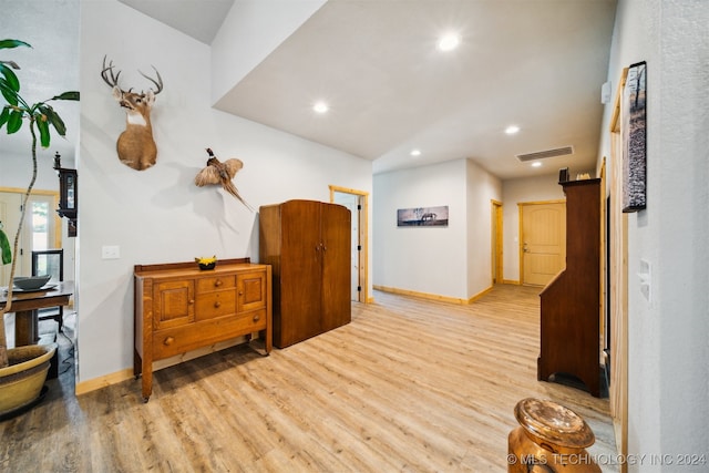 corridor featuring light hardwood / wood-style floors