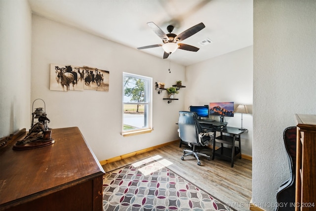 office area featuring light hardwood / wood-style flooring and ceiling fan