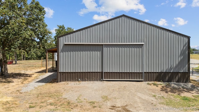 view of side of property with an outdoor structure