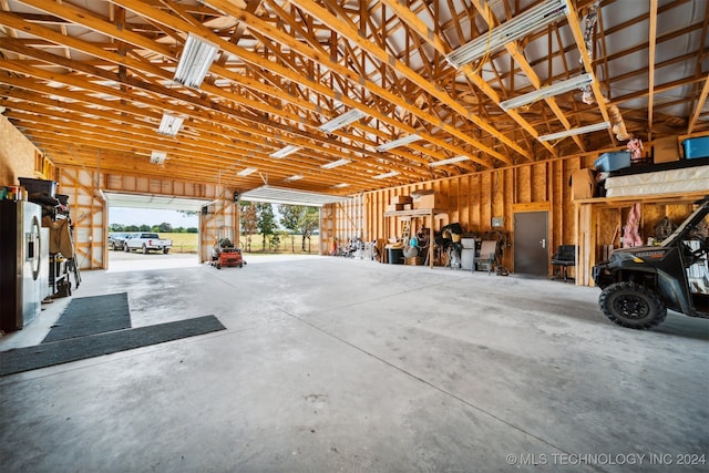 garage with stainless steel fridge