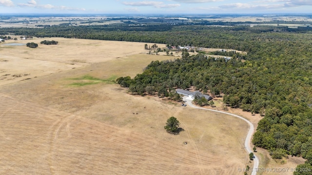 birds eye view of property with a rural view