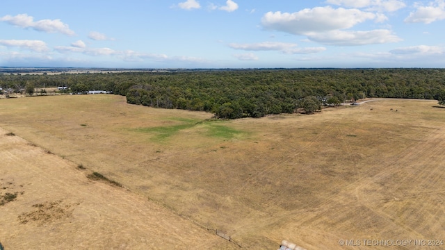 birds eye view of property with a rural view