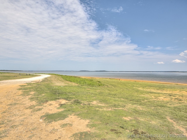 property view of water featuring a beach view