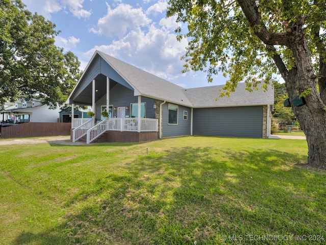 view of front of property with a front lawn and a porch