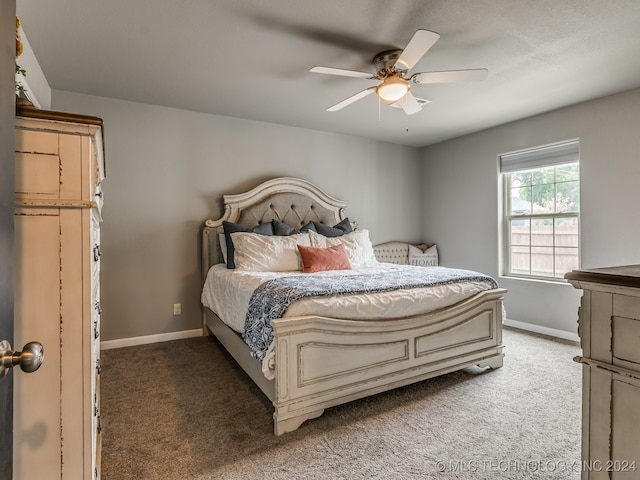 bedroom with ceiling fan and carpet floors