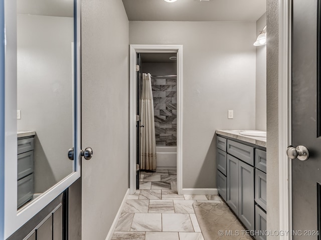 bathroom with vanity and shower / bath combination with curtain