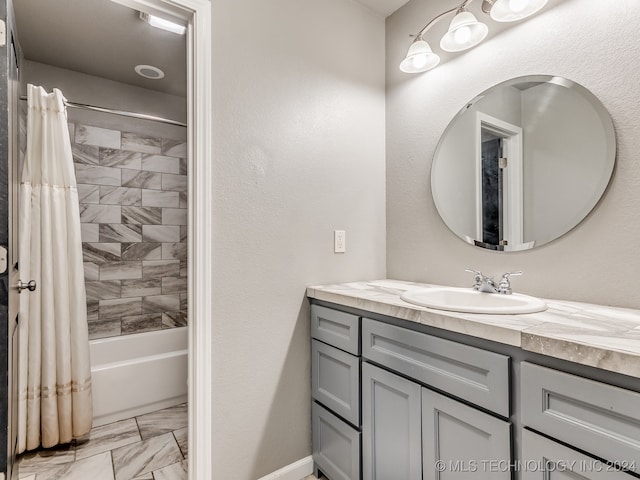 bathroom featuring vanity and shower / tub combo with curtain