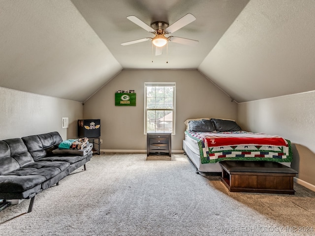 carpeted bedroom featuring ceiling fan, a textured ceiling, and lofted ceiling