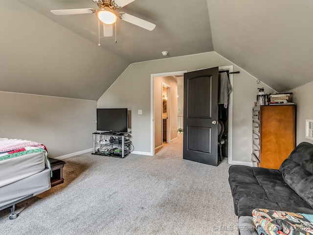 carpeted bedroom with ceiling fan and lofted ceiling