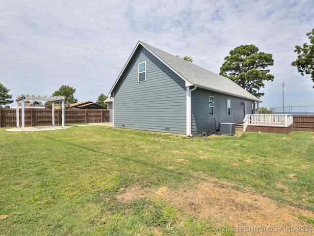 view of property exterior with central air condition unit, a patio area, a lawn, and a pergola