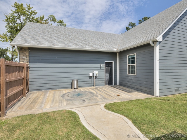 rear view of house with a lawn