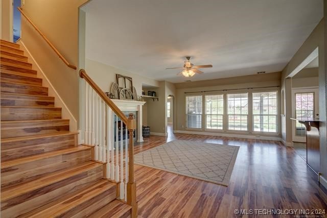 foyer entrance featuring ceiling fan and hardwood / wood-style flooring