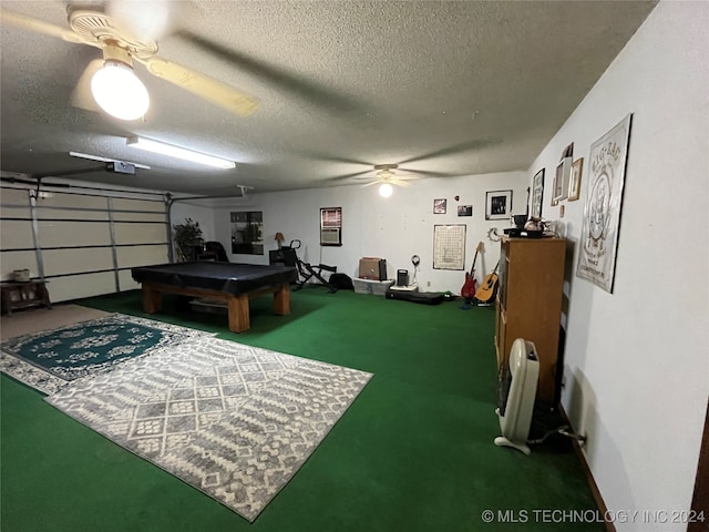 garage with ceiling fan and a garage door opener