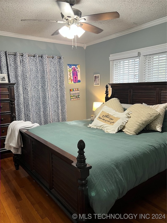 bedroom featuring a textured ceiling, crown molding, ceiling fan, and hardwood / wood-style floors