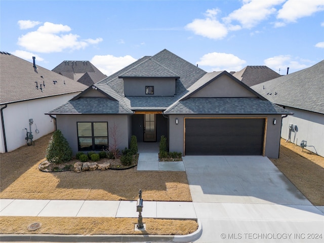 view of front of property with a garage