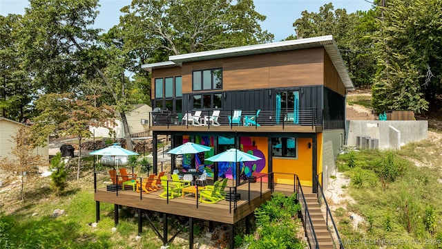 rear view of house with a wooden deck