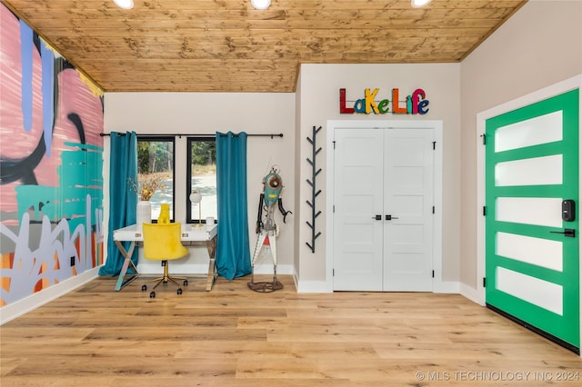 foyer featuring wood ceiling and light hardwood / wood-style floors