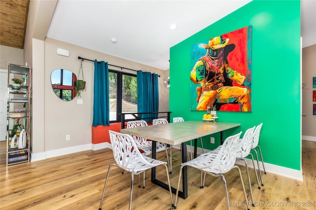 dining room with hardwood / wood-style flooring