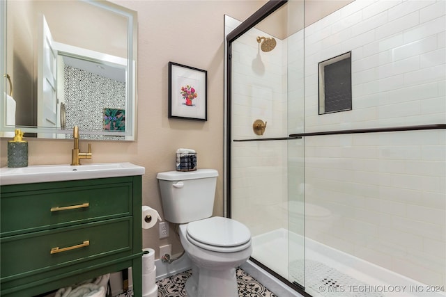 bathroom with vanity, toilet, and walk in shower