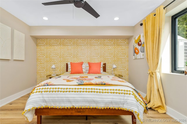 bedroom featuring ceiling fan and light wood-type flooring