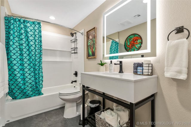 full bathroom featuring toilet, sink, and shower / bath combo with shower curtain