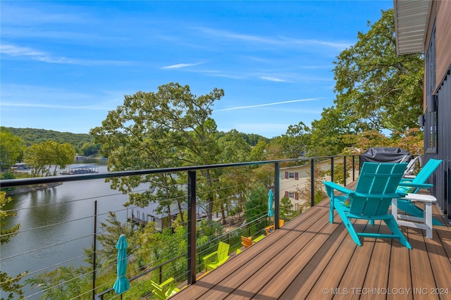 balcony featuring a water view