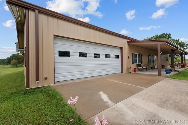 garage featuring a yard