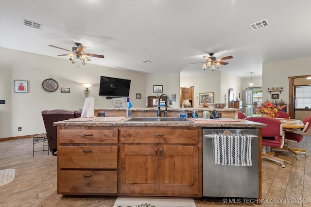 kitchen with light wood-type flooring, sink, and ceiling fan