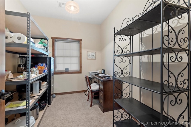 carpeted office with visible vents and baseboards