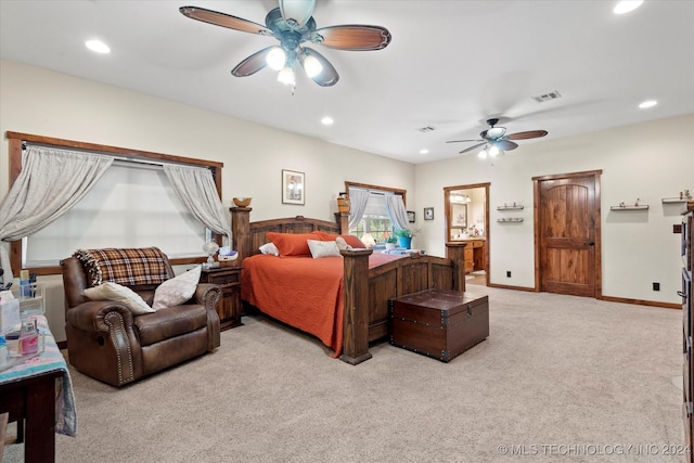 bedroom with connected bathroom, ceiling fan, and carpet