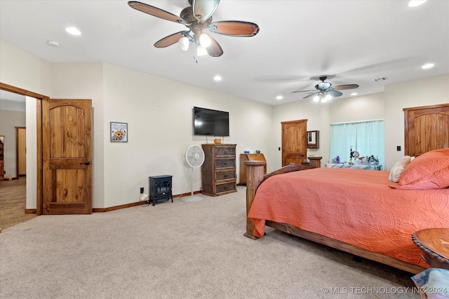 bedroom featuring visible vents, baseboards, recessed lighting, ceiling fan, and light colored carpet