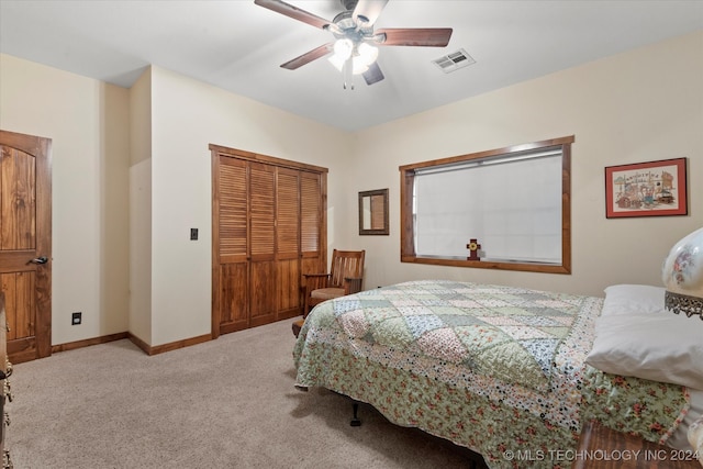 bedroom featuring carpet floors, ceiling fan, and a closet